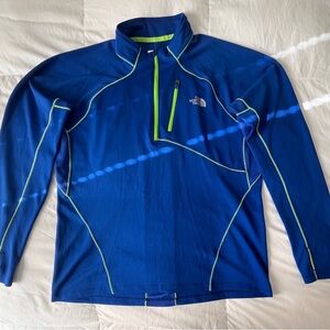 The North Face Blue performance pullover with neon stitching.